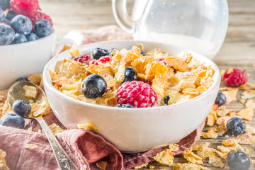 Healthy Corn Flakes for Breakfast with Milk and fresh summer berries