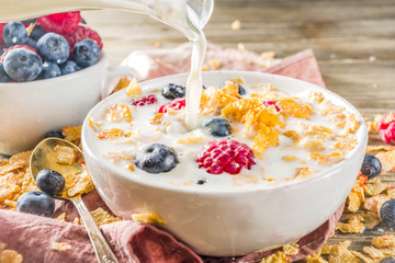 Healthy Corn Flakes for Breakfast with Milk and fresh summer berries