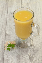 Dietary vegetarian oats milk over wooden