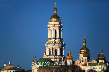 Fototapeta na wymiar Kiev Pechersk (Kyiv Pechersk) Lavra monastery and it’s bell tower (Great Belfry). Historical and cultural reserve – UNESCO object 