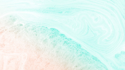Fototapeta na wymiar Abstract pastel marble with foam bubbles background. Summer beach background.