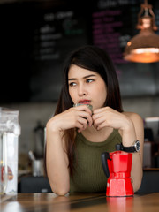 Beautiful barista behind coffee counter, work concept.