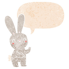 cute cartoon rabbit and speech bubble in retro textured style