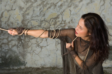 Woman pulling a rope
