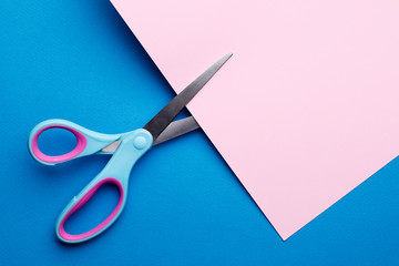 bright blue pink abstract blank paper background with scissors