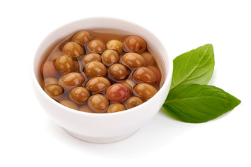 Pickled Arbequina Olives, close-up, isolated on white background