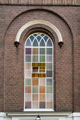 windows in arcade, detail of church Nunspeet, The Netherlands