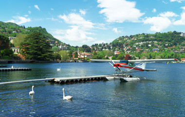 Fototapeta na wymiar Floatplane or seaplane on Como lake.