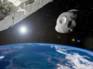 Space station and meteor above earth. The elements of this image furnished by NASA.