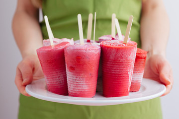 Homemade frozen ice cream popsicles from fruits