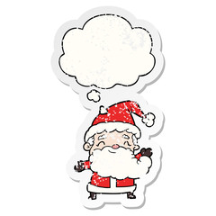 cartoon santa claus and thought bubble as a distressed worn sticker