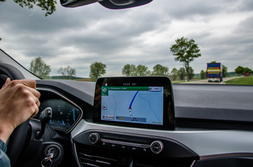 Navigator in the car shows the road