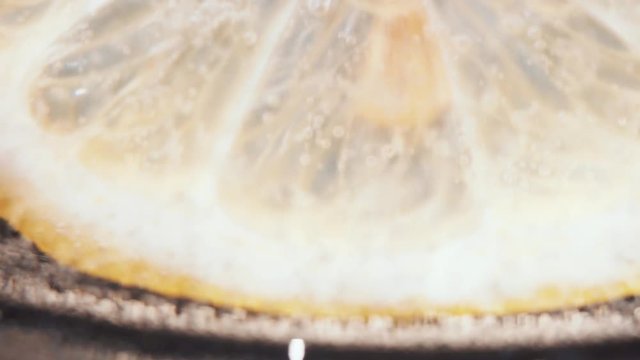 lemon slice on dark background close up