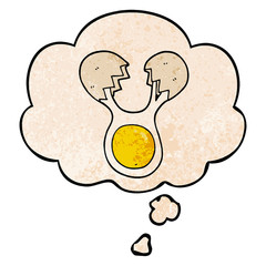 cartoon cracked egg and thought bubble in grunge texture pattern style