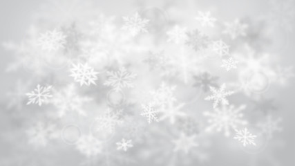 Fototapeta na wymiar Christmas blurred background of complex defocused big and small falling snowflakes in white and gray colors with bokeh effect