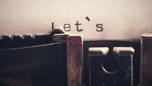 let's start being typed in close-up on an old vintage typewriter