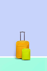 Set of suitcases standing on blue background. Travel concept