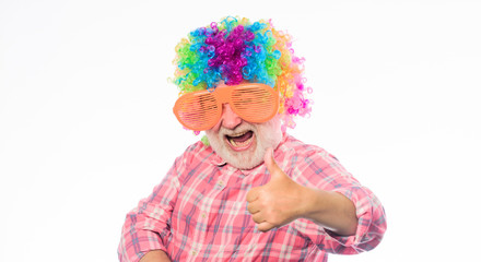 Funny lifestyle. Fun and entertainment. Comic grandfather concept. Nice joke. Grandpa always fun. Man senior bearded cheerful person wear colorful wig and sunglasses. Elderly clown. Having fun