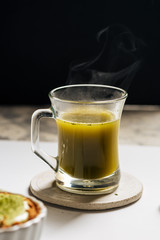 Hot matcha tea in transparent cups