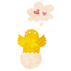 cute hatching chick cartoon and thought bubble in retro textured style