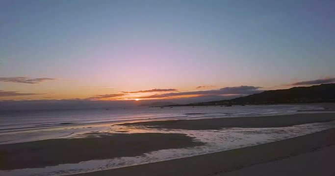 Sunset at a stunning Galician beach with a river estuary and a forest nearby n4
