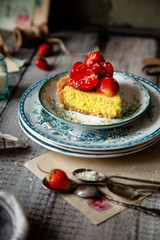 Slice of homemade delicious strawberry tart or pie with sweet glazed berries on top