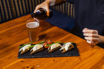 beer snacks on a dark rectangular stand
