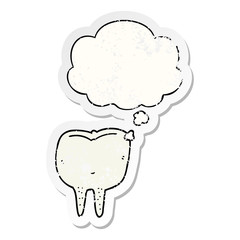 cartoon tooth and thought bubble as a distressed worn sticker