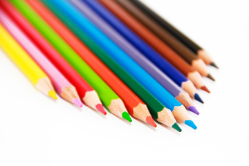 colorful wooden pencils for drawing on white background