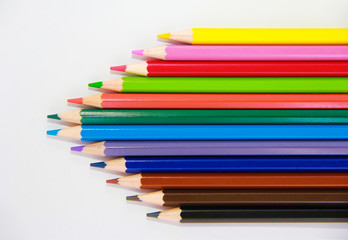 colorful wooden pencils for drawing on white background