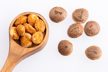 Dried seeds of sacha fruit - Inchi peanuts - Plukenetia volubilis. White background