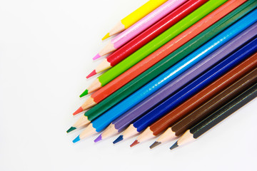 colorful wooden pencils for drawing on white background