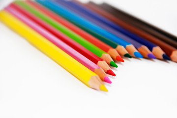 colorful wooden pencils for drawing on white background