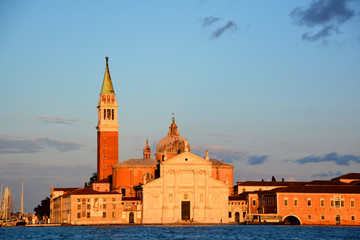 VENICE ITALY JUNE 01 2019: At sunset Campanile and the Church of San Giorgio Maggiore (16th-century...