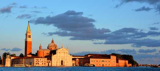 VENICE ITALY JUNE 01 2019: At sunset Campanile and the Church of San Giorgio Maggiore (16th-century...