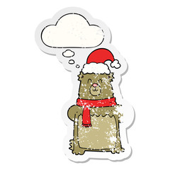 cartoon bear wearing christmas hat and thought bubble as a distressed worn sticker