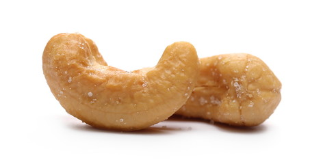 Salted cashew nuts isolated on white background