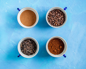 four symmetrical cups of tea, coffee and cocoa