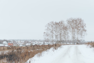 winter landscape of a deserted snow field and leaden sky