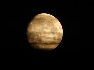 Almost full blood moon in the black sky as background with copy space