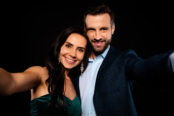Close up photo rich pair classy she her beautiful he him his macho toothy make take selfies enjoy anniversary party chill wear blue plaid costume jacket velvet green dress isolated black background