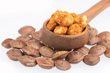 Dried seeds of sacha fruit - Inchi peanuts - Plukenetia volubilis. White background