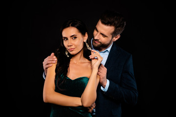 Close up photo beautiful pair classy she her chic coquettish earring fingers he him his hold shoulders tender look piggyback pose wear blue plaid costume jacket green dress isolated black background