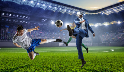 Obraz na płótnie Canvas Black businessman on virtual reality football match