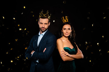 Portrait of his he her she nice-looking classy fascinating attractive glamorous luxurious smart two person flying decorative elements folded arms ego isolated on black background © deagreez