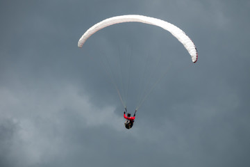 Paraglider in flight with the sky in background