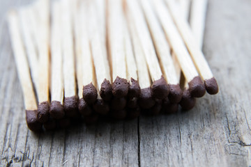 matches on a gray wooden board, macro shooting
