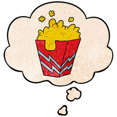 cartoon box of popcorn and thought bubble in grunge texture pattern style