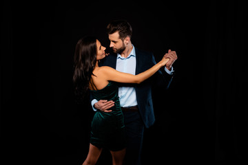 Close up back rear behind photo beautiful she her wife spine he him his husband mrs mr married spouse hold hands tango slow dance position wear costume jacket green dress isolated black background