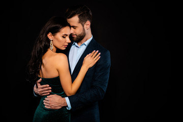 Close up side profile photo beautiful she her wife bride he him his husband fiance mrs mr married spouse protect hands slim waist hold close wear costume jacket green dress isolated black background